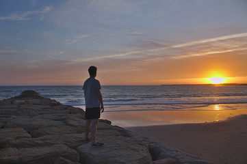 Watching the sunset over the neighboring town, El Puerto de Santa María, Cádiz, Spain © Greig