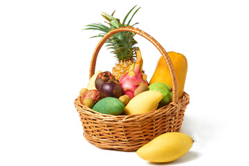 Basket of juicy asian fruits isolated on a white background.