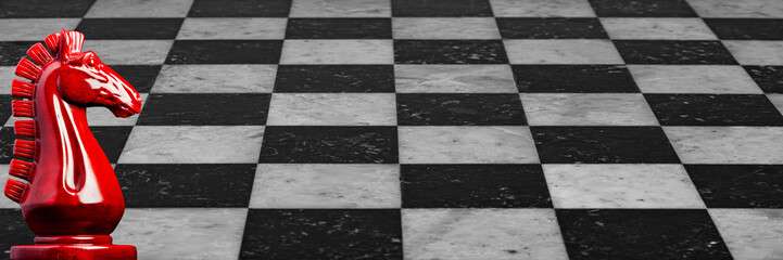 Image of a wooden chess knights in red with marble checkerboard background