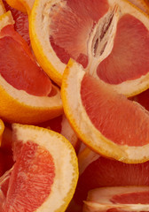 Grapefruit web banner background. Pile of fresh cut grapefruits. Fruits summer bright concept
