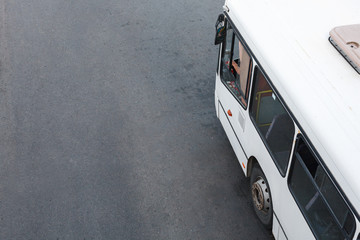 Modern city bus on city street, top view of passenger coach vehicle moving along town road. Public transportation system city. There is some free space for your text or sign. © bm_photo