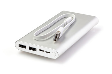 An additional stand-alone power bank for charging mobile devices. External battery isolated on a white background. White charger for smartphone with power supply (battery bank). Full depth of field.