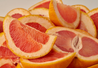 Grapefruit web banner background. Pile of fresh cut grapefruits. Fruits summer bright concept