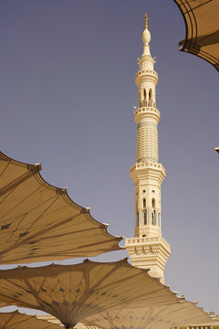 Medina Mosque Minaret And Sun Umbrellas