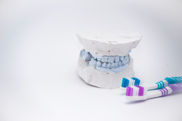 Fototapeta na wymiar Oral care. Sweets destroying teeth and a toothbrush. Person's choice
