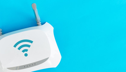 Topical networking and Internet technology: top view Wireless Router modem switch on blue background with copy space. concept of technological services, networks and internet service.