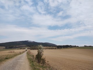 Sunrise and sunset, beautiful clouds over the meadow, hills and buildings in the town. Slovakia