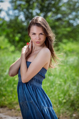 Young woman in blue dress