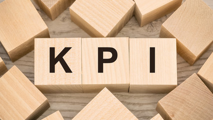 Key Performance Indicator KPI acronym word lettering typography design on wooden blocks