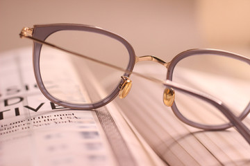 glasses on the newspaper
