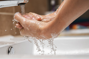 Woman washing her hands