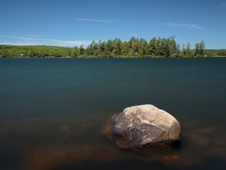 A long exposure Eagle Lake with a rock in the foreground, Sundridge, Ontario