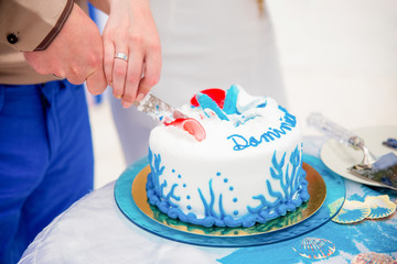 Tropical wedding cake for bride and groom to cut during destination wedding marriage outdoor ceremony on the sandy beach in Dominican republic 