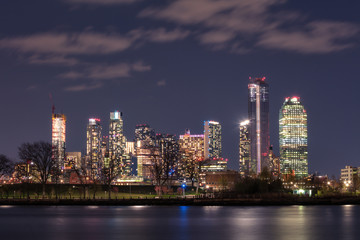 View on Queens skyline at night from East river with long exposure