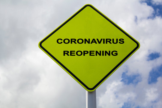 Yellow Sign With Lthe Text Coronavirus Reopening. COVID-19 Ease Lockdown Restrictions Concept