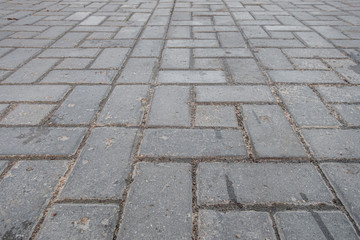 abstract background of wet tiles on the sidewalk after rain close up