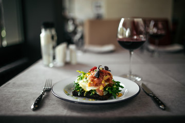 Served rye toast with poched egg and salmon