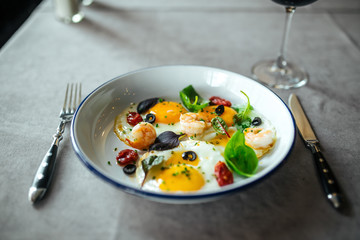 Closeup gouret breakfast fried eggs with shrimps