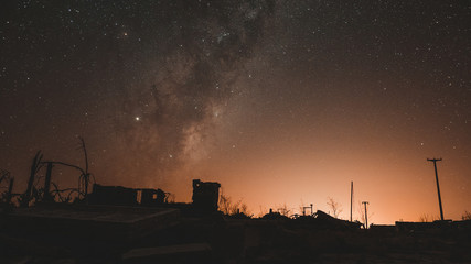 Night photography of the ruins of epecuen, the stars light up the sky near the carhue town, Provincia de Buenos Aire, Argentina.