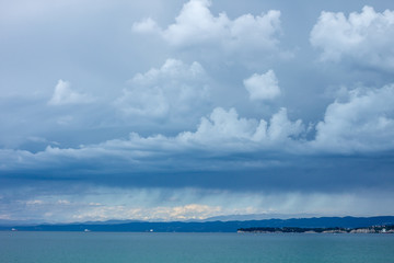 dramatic dark blue stormy sky over sea surface
