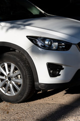 Clean headlights of white car. Close-up, headlight car Projector/LED of a modern luxury technology and auto detail