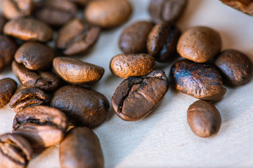 coffee beans isolated on a white background, scattered, close-up