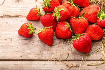 Strawberries on a wooden surface background