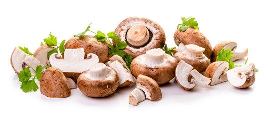 Brown champignons and parsley. Isolate on white background