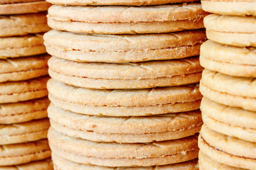 Stacks of typical dutch Syrup Cookies (stroopkoeken) a variant of the famous Gouda syrup waffle (stroopwafels). Shallow depth of field.