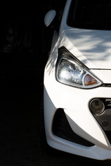 Clean headlights of white car. Close-up, headlight car Projector/LED of a modern luxury technology and auto detail