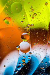 multicolored drops of oil in the water