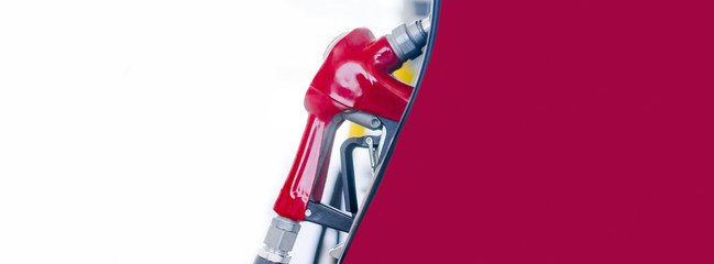 Red fuel nozzle in Gas station.Fuel dispensing pump,Banner shot of fuel pumps at a gas station.The...