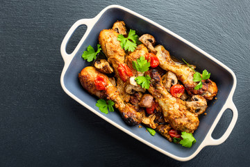 Baked chicken legs with vegetables