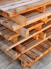 
wooden pallets stacked in a stack on the street side view