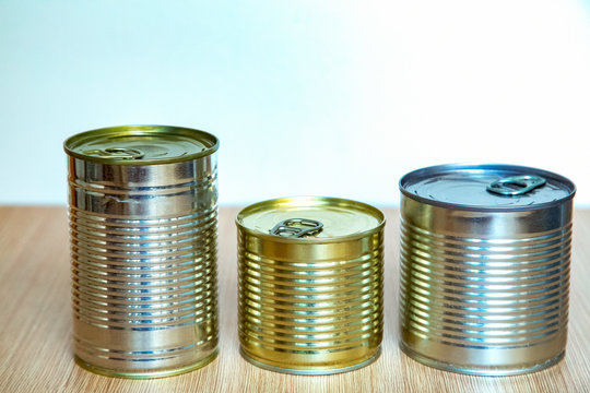 a tin can,an iron can, is on the table