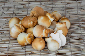 Italian cheese burrata on a wooden table close up. Mini whole tied Italian cheese . Provolone cheese with slices isolated . Fresh dairy product, healthy organic food. Delicious appetizer.