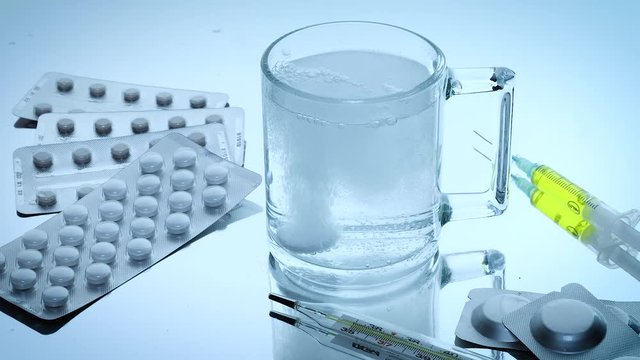 virus pill dissolves in a glass of water