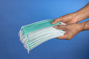 medical staff offering surgical mask for covid-19 situation