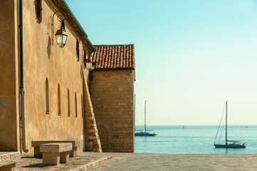 ANTIBES,FRANCE-SEPTEMBER14,2013:historical building detail and sea view with yacts.