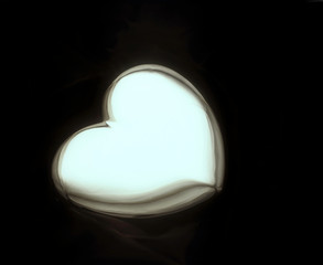 highly reflective silver heart still life scene.