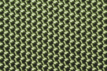 Green synthetic material. fabric texture close up. woven background. braided surface. stitches of fibers
