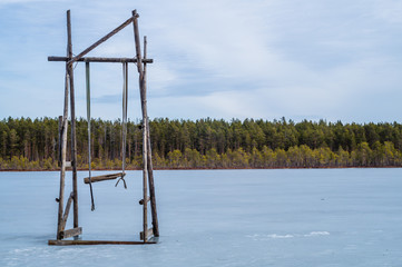 Swing stand on a frozen lake. solitude concept. nature landscape