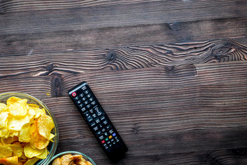 snacks for watching TV on wooden background top view mock-up