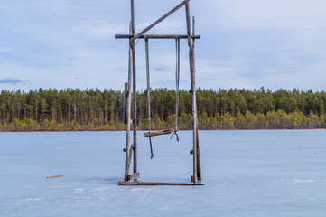 Swing stand on a frozen lake. solitude concept. nature landscape