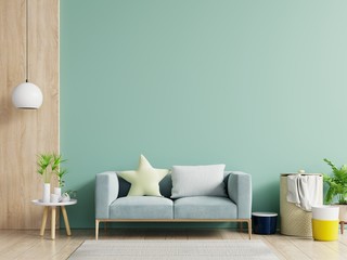 Empty living room with blue sofa, plants and table on empty green wall background.