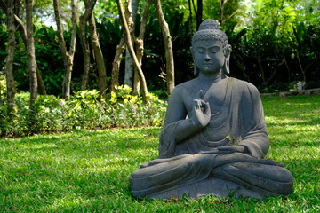 Yogyakarta Indonesia - meditating Buddha statue in garden
