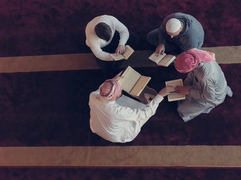 Top View Of Muslim People In Mosque Reading Quran Together