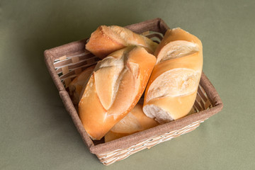 Various pieces of bread in a wicker basket