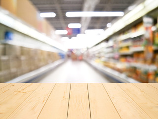 wooden table or wooden mock up over blurred supermarket background