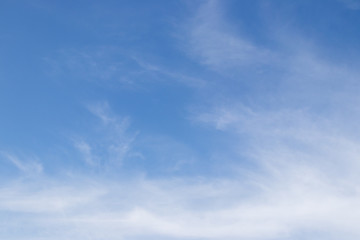 Clear blue sky with white cloud background